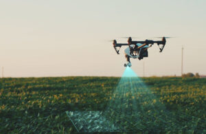 A white drone flying above a field of product scanning the crops. Foresight says NVIDIA Jetson will help drone perception.