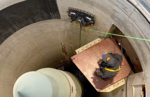 A Gecko crawler robot inspecting the side of a missile silo.