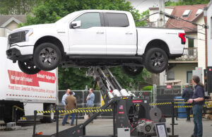 RISE Robotics demonstrates Beltdraulic SuperJammer robot arm lifting a Ford F 150 Lightning.