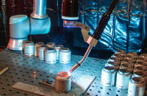 Close up of welding cobot. Cobots can add value in manufacturing, according to an upcoming webinar.