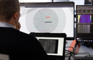 Saildrone and Thales engineers look at a detection event during structured testing of the Saildrone Surveyor equipped with a Thales BlueSentry thin-line towed array.